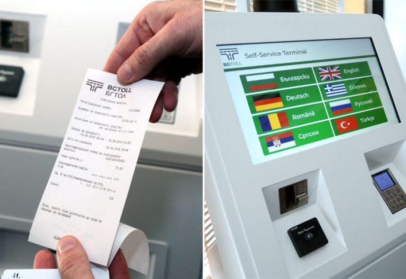 hands holding BG toll receipt and machine for toll ticket purchase